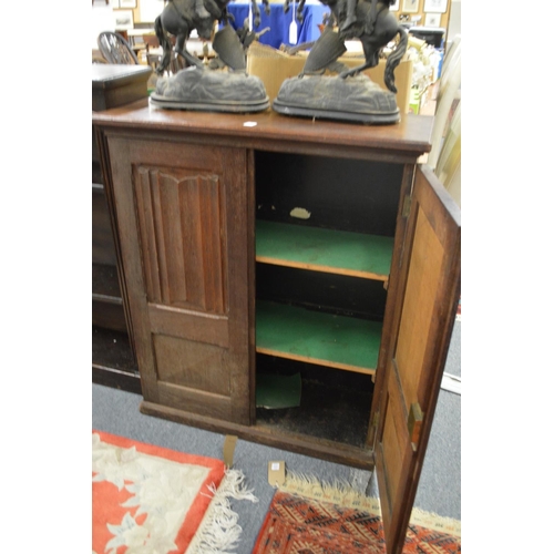 288 - A linenfold decorated oak two door cupboard.