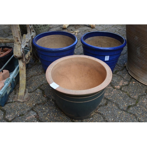 29 - A pair of blue glazed plant pots and a similar pot.