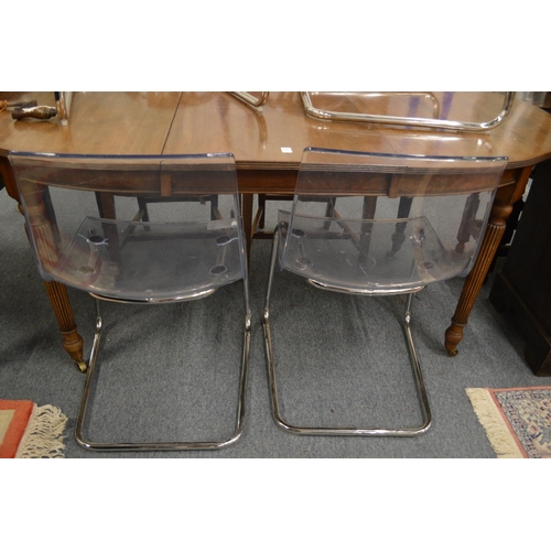 290 - A set of four stylish perspex and chrome framed dining chairs.