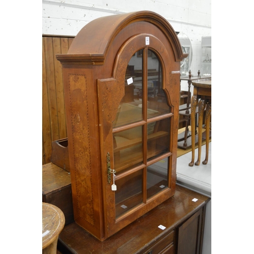 296 - A Dutch style walnut dome top hanging display cabinet.