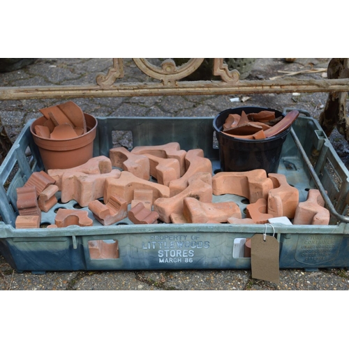 30 - A quantity of terracotta plant pot feet.