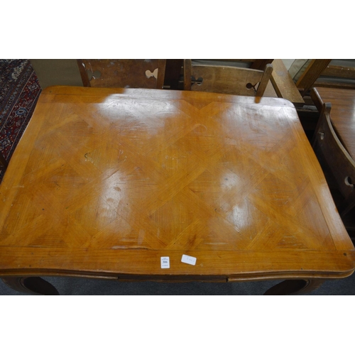 306 - A French fruitwood draw leaf dining table.