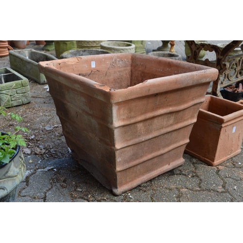 32 - A very large square shaped terracotta plant pot (rim damaged).