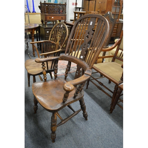 325 - A Victorian ash and elm broad arm Windsor chair.