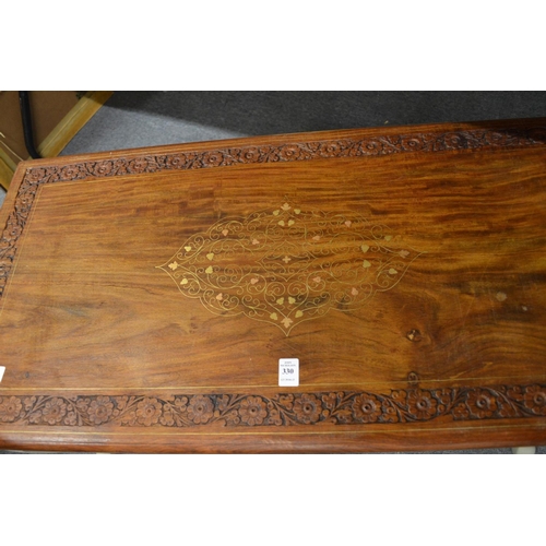 330 - An Eastern brass inlaid hardwood and painted coffee table.