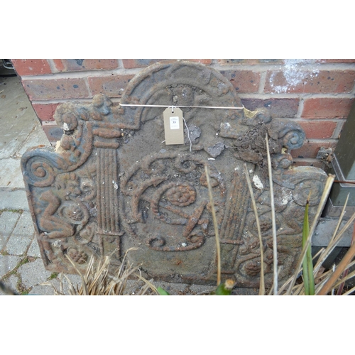 35 - A large cast iron fireback.