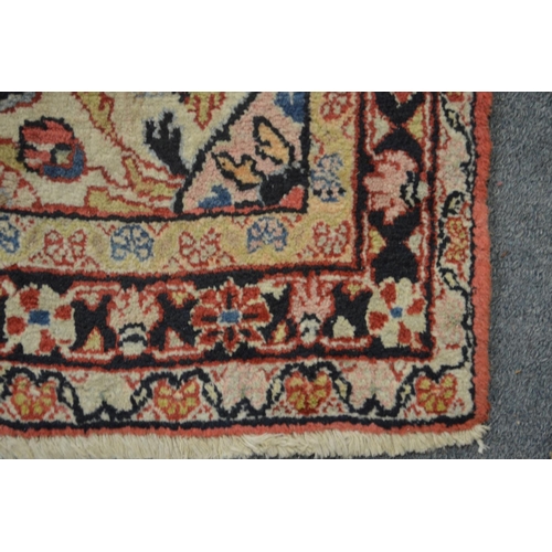 358 - A Persian rug, pink ground with floral decoration 168cm x 103cm.