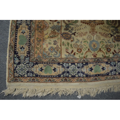 359 - A Persian carpet, cream ground with stylised decoration 219cm x 138cm.