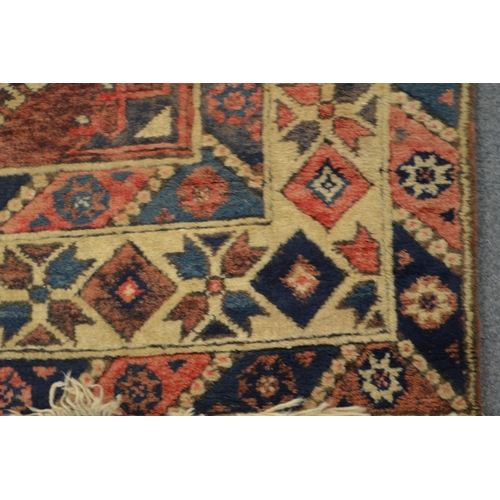 362 - A Persian design rug, pink ground with all-over geometric design 185cm x 118cm.