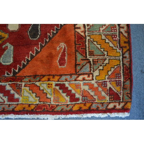 364 - A colourful Persian design carpet 240cm x 150cm.