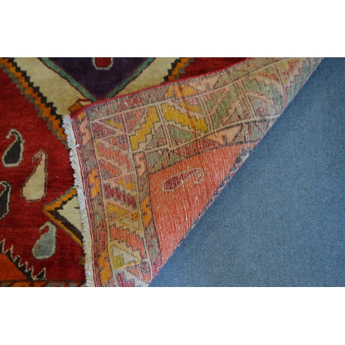 364 - A colourful Persian design carpet 240cm x 150cm.