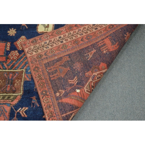 366 - An unusual modern Persian carpet, decorated all over with birds and animals 205cm x 150cm.