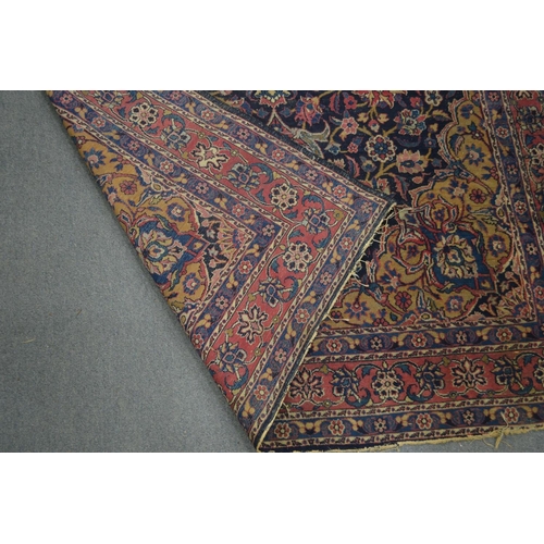 367 - A Persian carpet, blue ground with floral decoration 270cm x 150cm.