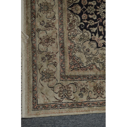 369 - A Persian part silk rug, cream and blue ground with stylised floral decoration 155cm x 93cm.