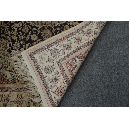 369 - A Persian part silk rug, cream and blue ground with stylised floral decoration 155cm x 93cm.