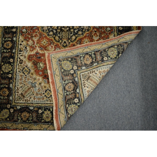 370 - A Persian part silk rug with stylised floral decoration 135cm x 81cm.