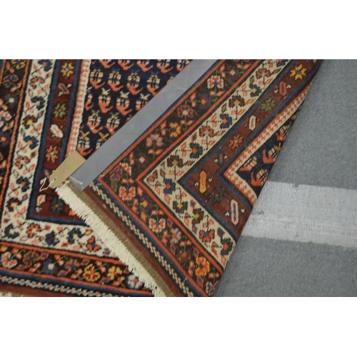 373 - A Persian runner or hall carpet, decorated with stylised Boteh design 450cm x 110cm.