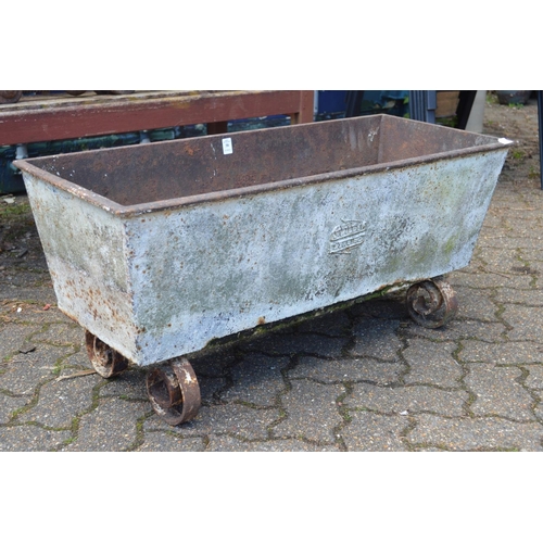 38 - A cast iron rectangular trough on wrought iron feet.