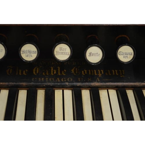 386 - A Victorian walnut cased organ manufactured by The Gable Company, Chicago, USA.