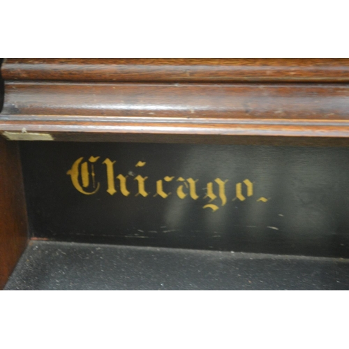 386 - A Victorian walnut cased organ manufactured by The Gable Company, Chicago, USA.