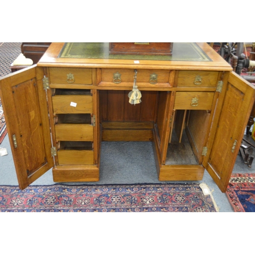 388 - A good small oak pedestal desk.