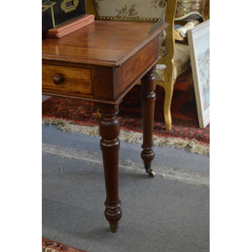 389 - Gillows of Lancaster, a good mahogany two drawer writing table.