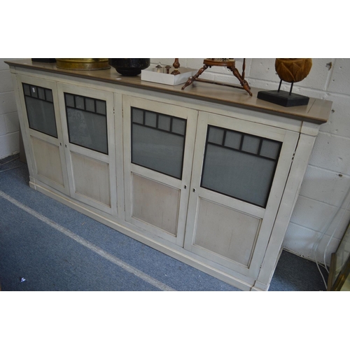 393 - A stylish painted French four door low cupboard.