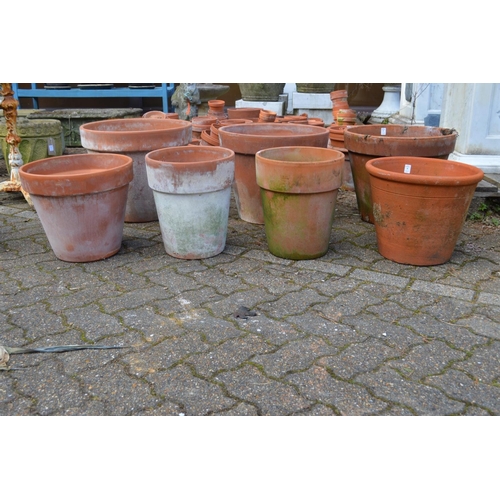 4 - Four large terracotta plant pots.