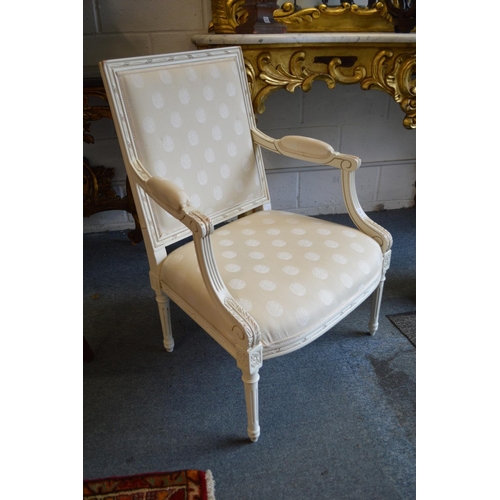 411 - A pair of French style cream painted and upholstered open armchairs.