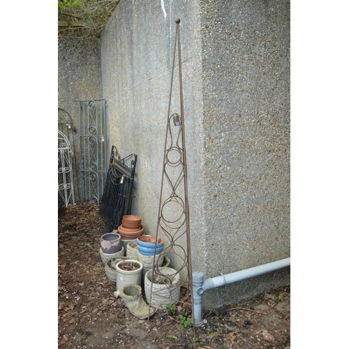 54 - A wrought iron plant spire 243cm high including feet.