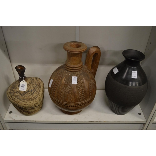 563 - Studio pottery vase, an African carved wood jug and another vase.