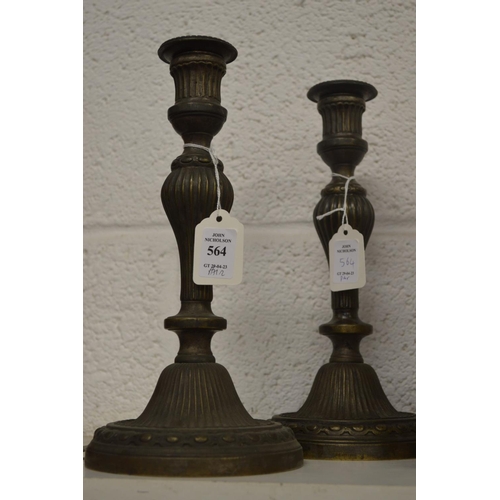 564 - A pair of brass candlesticks.