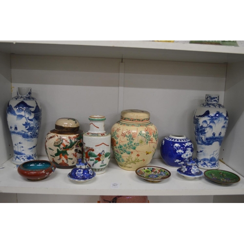 567 - A shelf of Oriental porcelain and cloisonne items.