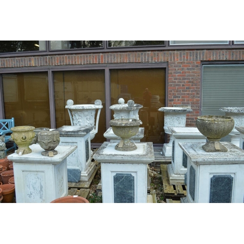 59 - Four various composite garden pedestal planters.