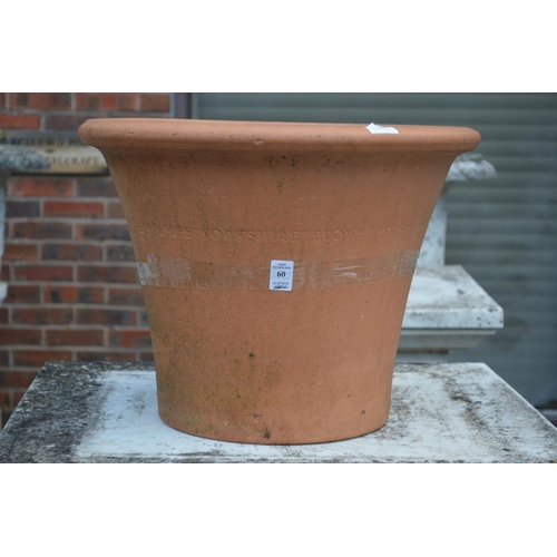 60 - A large terracotta plant pot.