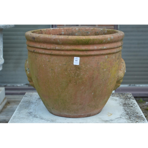 61 - A large terracotta plant pot.