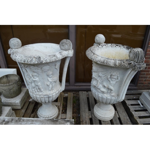 63 - A large impressive pair of Italian carved white marble twin handled urns, one repaired 110m high.