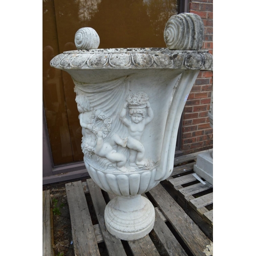 63 - A large impressive pair of Italian carved white marble twin handled urns, one repaired 110m high.