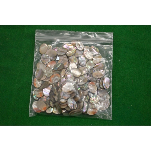 898 - A bag of abalone shell discs.