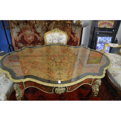 390 - A good Boulle and ormolu mounted single drawer centre table of serpentine outline on cabriole legs.