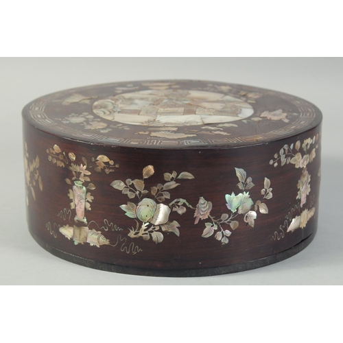 116 - A CHINESE MOTHER OF PEARL INLAID CIRCULAR BOX AND COVER, with a central panel depicting a scene with... 