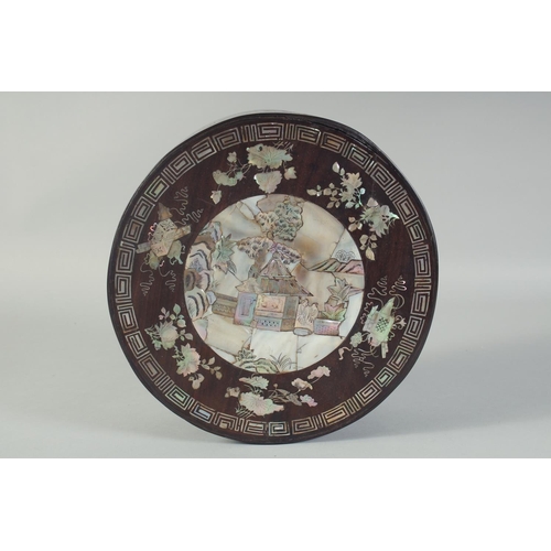 116 - A CHINESE MOTHER OF PEARL INLAID CIRCULAR BOX AND COVER, with a central panel depicting a scene with... 