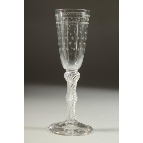 1071 - A GOOD 18TH CENTURY ENGLISH WINE GLASS the bowl engraved with stars, with air twist stem. 7.5ins hig... 