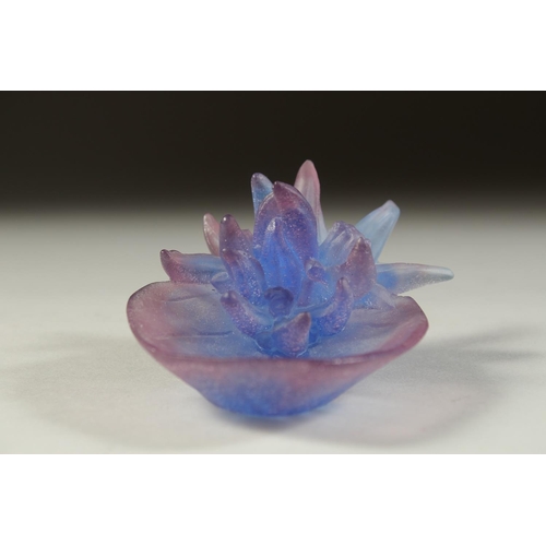 1094 - A SMALL DAUM BLUE GLASS FLOWERS AND LEAF. Signed, Daum, France. 3.25ins in original box.