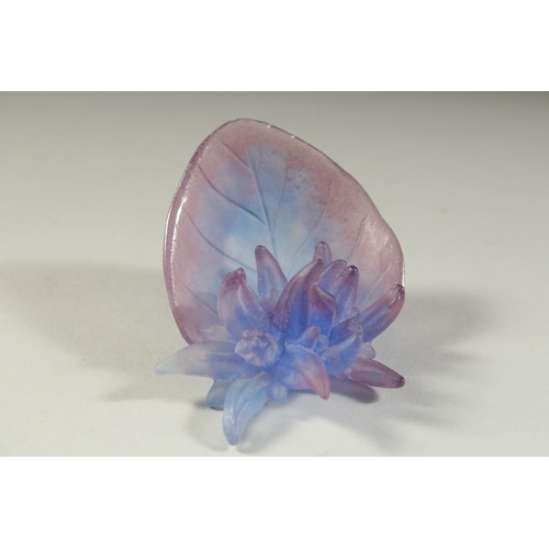 1094 - A SMALL DAUM BLUE GLASS FLOWERS AND LEAF. Signed, Daum, France. 3.25ins in original box.