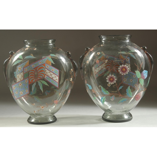 1099 - A GOOD PAIR OF ART DECO GLASS VASES with enamel decoration. 7ins high.