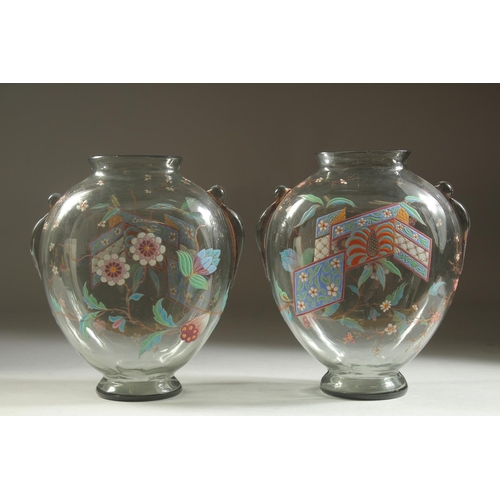 1099 - A GOOD PAIR OF ART DECO GLASS VASES with enamel decoration. 7ins high.