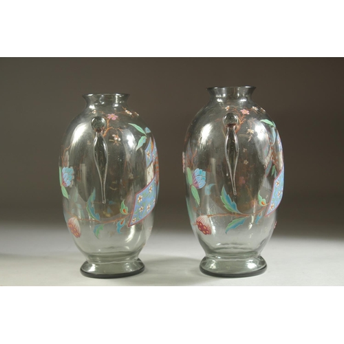 1099 - A GOOD PAIR OF ART DECO GLASS VASES with enamel decoration. 7ins high.