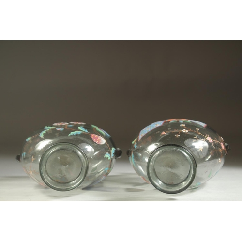 1099 - A GOOD PAIR OF ART DECO GLASS VASES with enamel decoration. 7ins high.