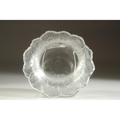 1101 - A LALIQUE CIRCULAR BOWL the rim with flower petals. 6ins diameter.